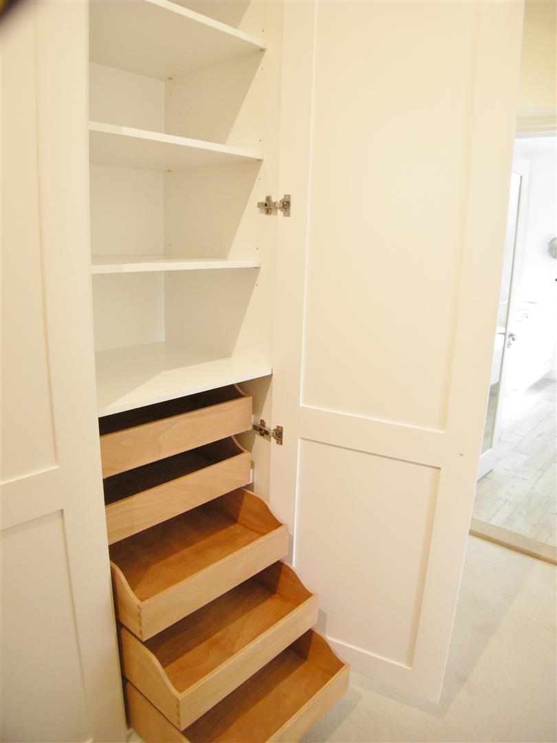 When you like the look of a tall wardrobe door, revealing handmade open oak drawers.