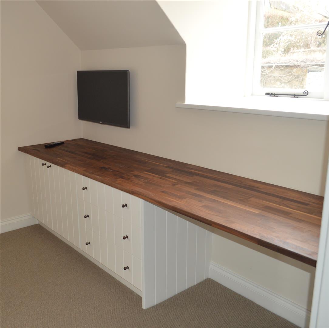 Another picture of the work station with the solid oak top creating a nice contrast with the white of the cabinetry.