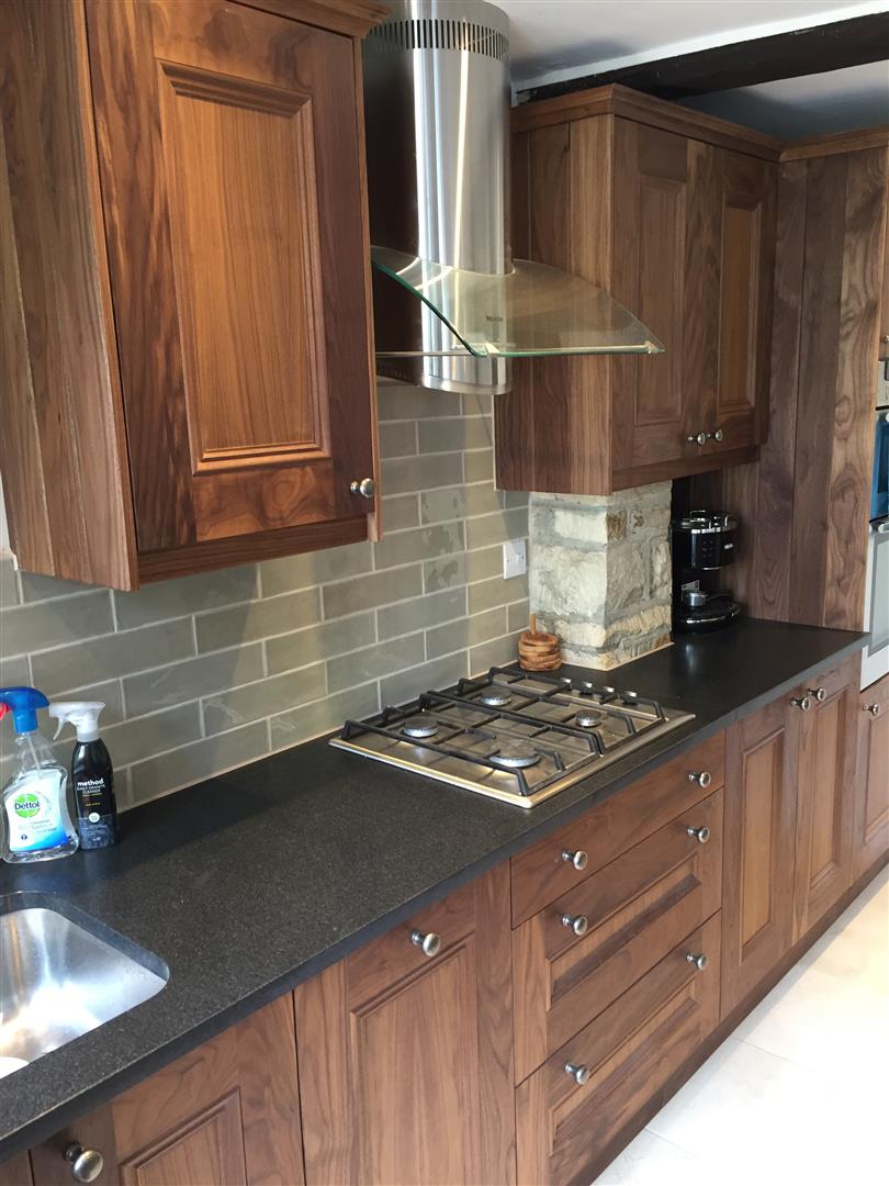 Redbrook kitchens design and install bespoke kitchens in Gloucestershire Warm and comfortable American Walnut traditional Ogee moulded doors