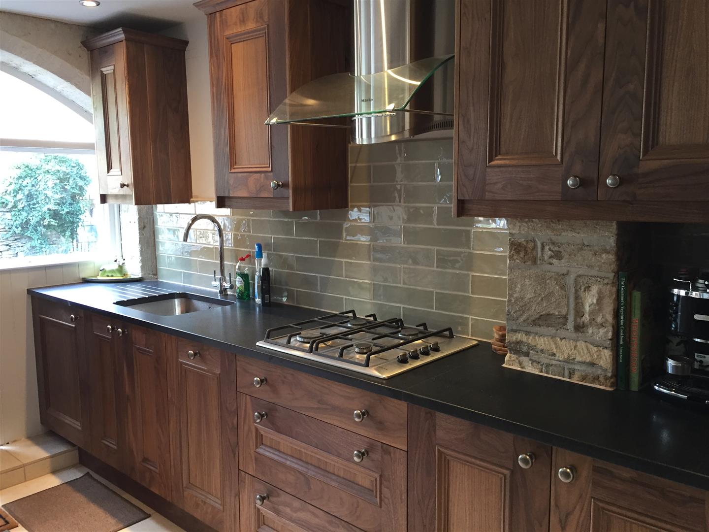 Redbrook kitchens design and install bespoke kitchens in Gloucestershire Compact run of walnut for a small unit