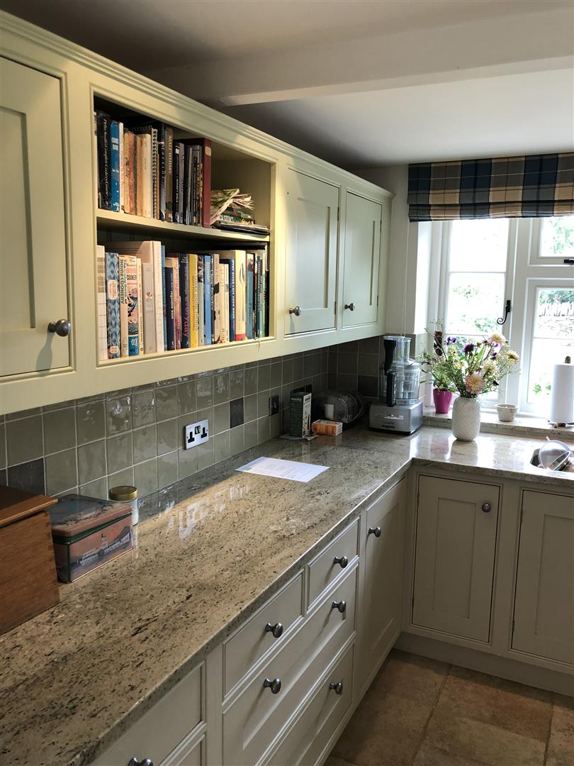 Redbrook kitchens design and install bespoke kitchens in Gloucestershire. Open shelves become a colourful feature