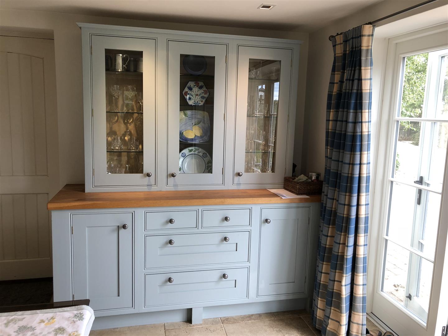 Redbrook kitchens design and install bespoke kitchens in Gloucestershire. Traditional proportions framing an attractive front framed Shaker dresser